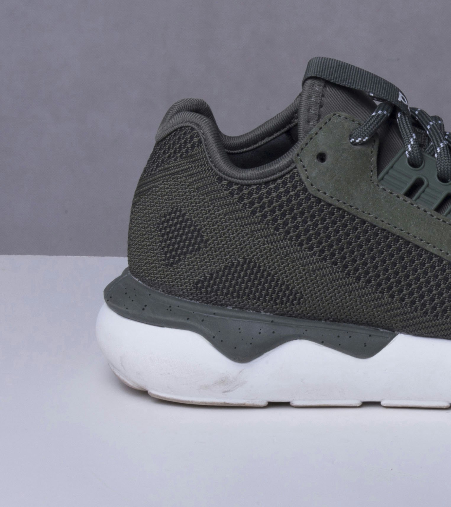 footwear-retouching-cleanup-before Photo of sneaker heel showing scuffs and dirt marks